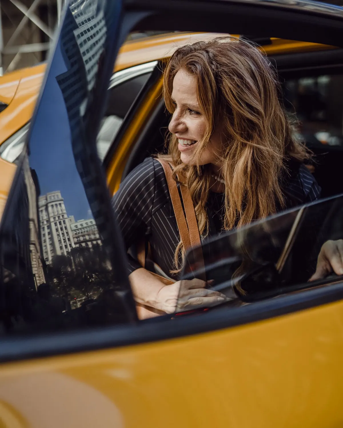 Smiling passenger in a taxi
