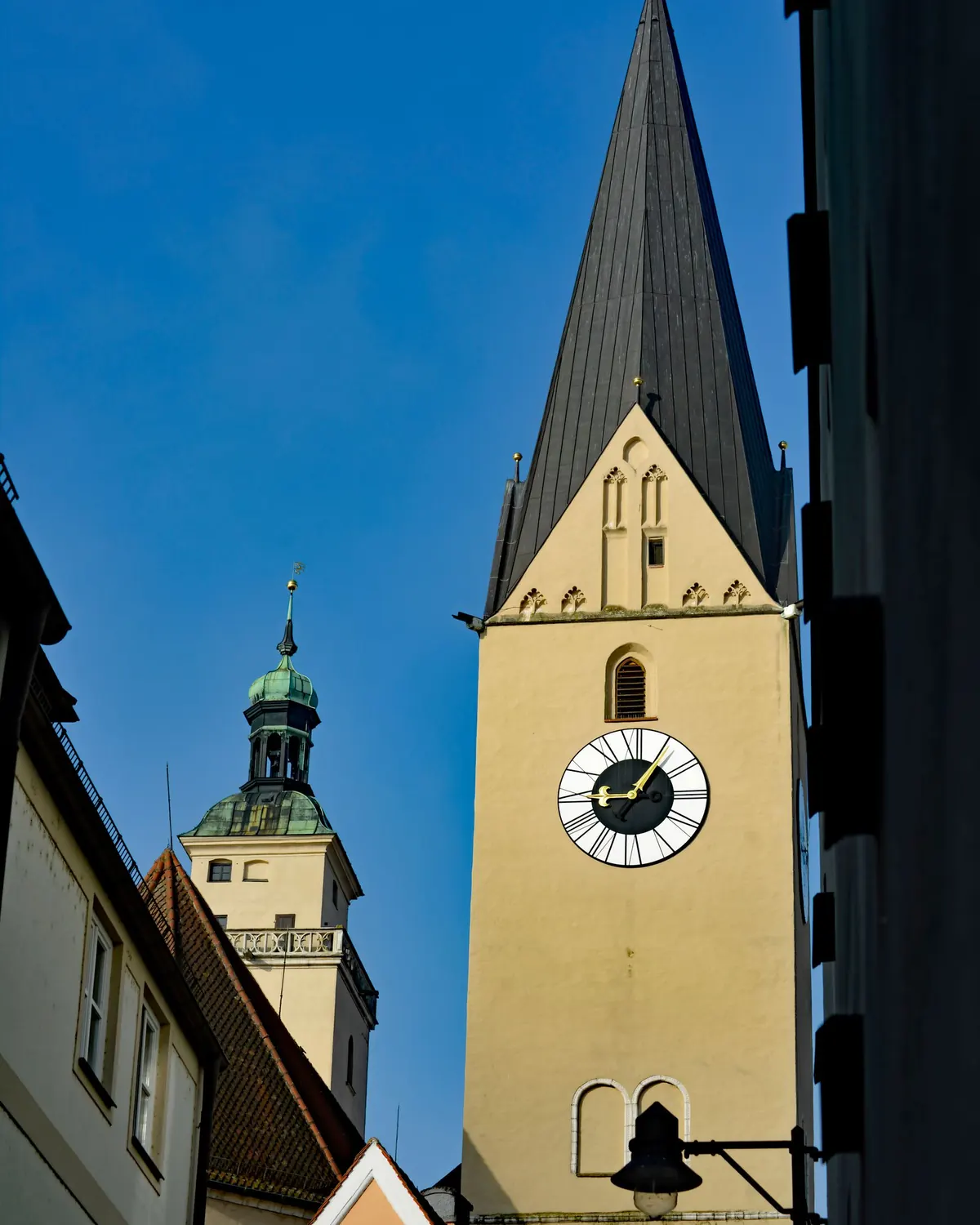Towers of the Ingolstadt Minster against a blue sky